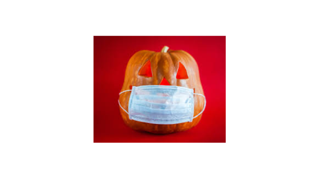 Jack-o'-lantern curved pumpkin with a Covid mask over its mouth
