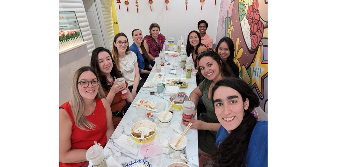 Xiomarie Xiomarie Alejandro Navarreto, Andrea Ochoa-Raya, Morgann MacDonald, Abigail Garrett, Adriana Zimnicka, Giri Chandrasekharan, Ashley Huang, Ann Tran, Mennat Gharib, and Mercy Kremer eating lunch in a restaurant